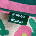 Label 'Normal is boring groen'